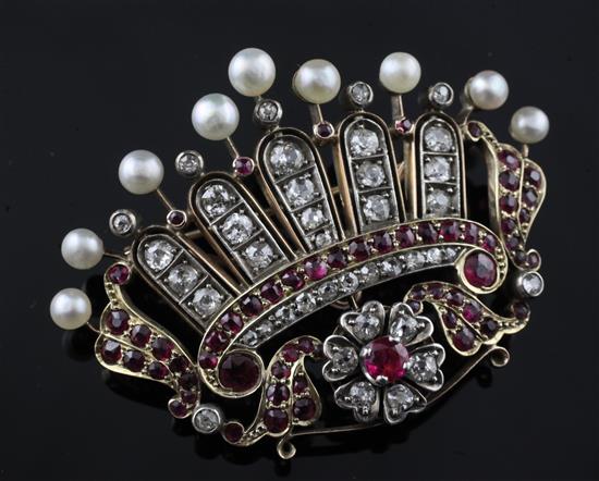 A late 19th/early 20th century gold, ruby, diamond and pearl coronet brooch, width 52mm.